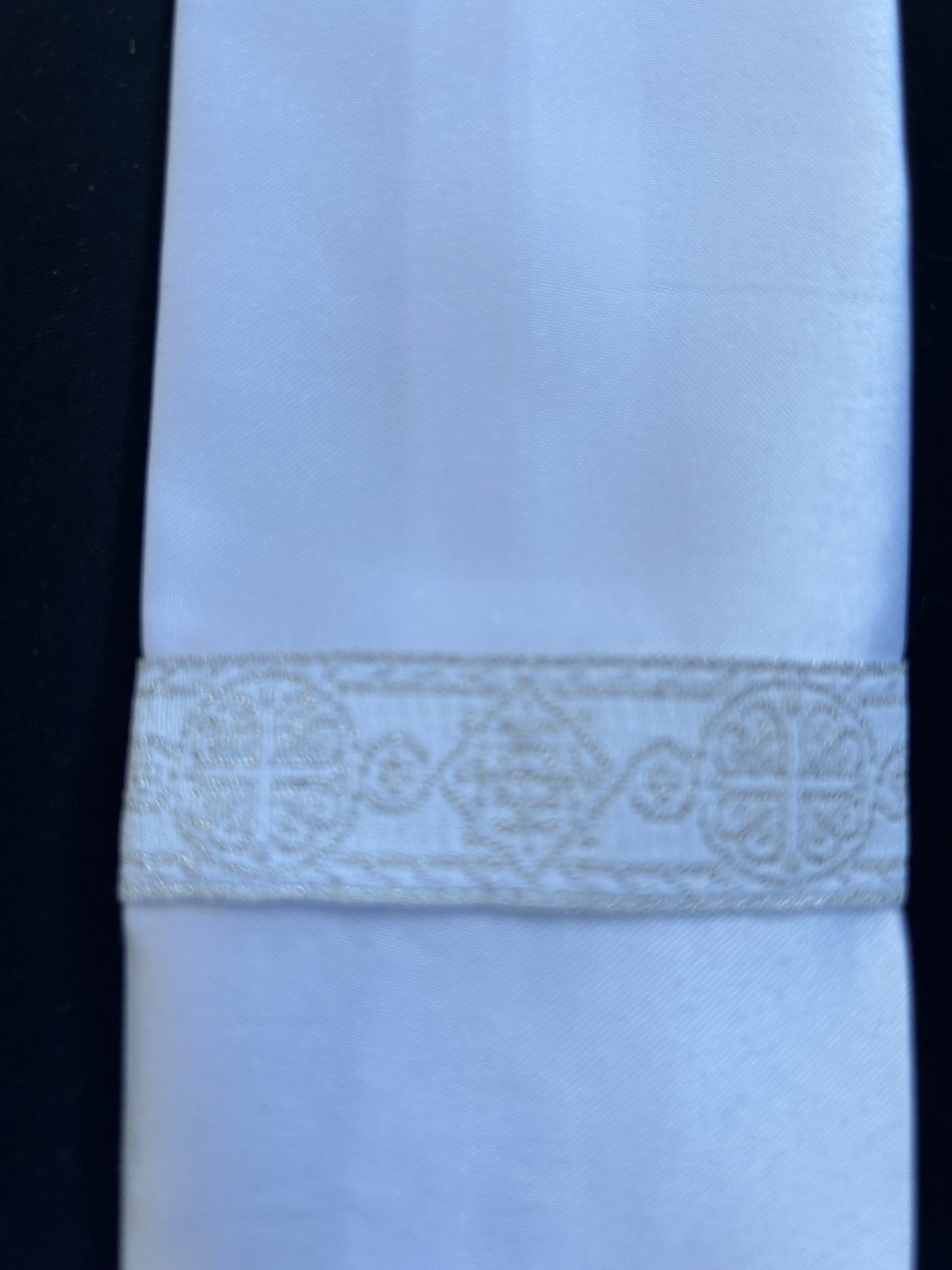 White satin Baptism stole with silver ecclesiastical braid trim.