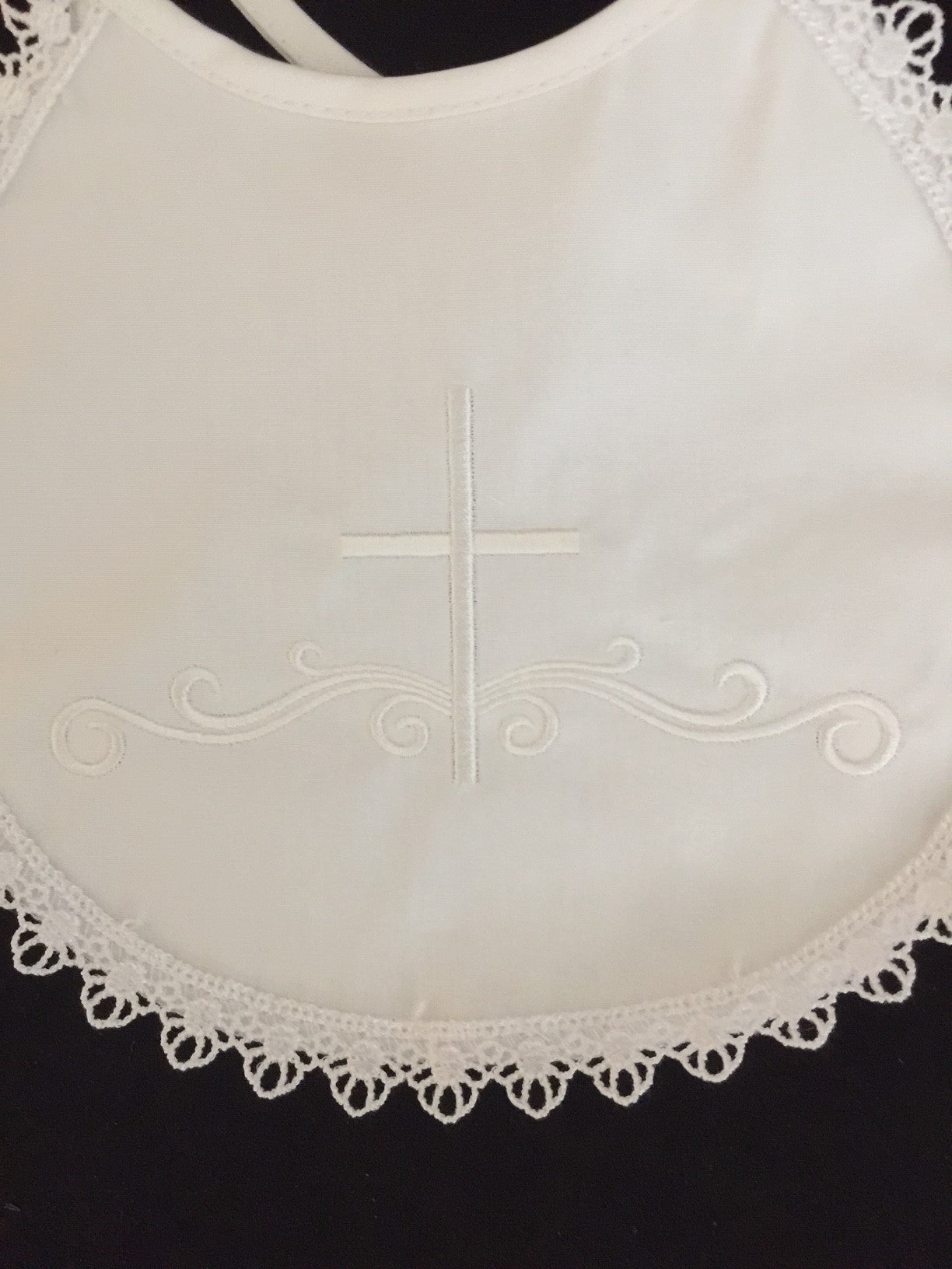 bb-2 - cotton bib with cross and lace trim.
