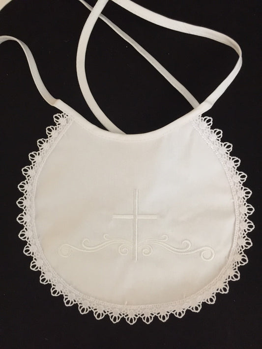 bb-2 - cotton bib with cross and lace trim.
